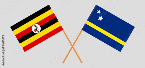 Crossed flags of Uganda and Country of Curacao. Official colors. Correct proportion