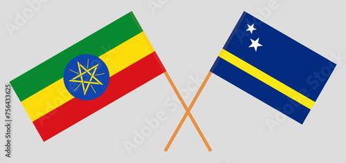 Crossed flags of Ethiopia and Country of Curacao. Official colors. Correct proportion