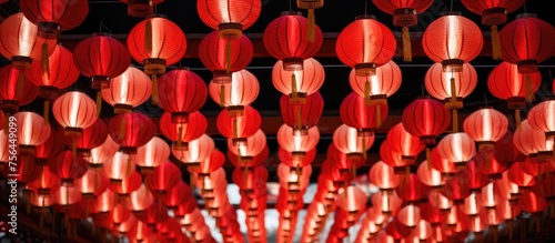 Red and white lanterns are suspended overhead.