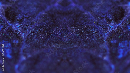 Wet glitter texture. Paint kaleidoscope. Defocused blue purple color shimmering particles ink flow motion symmetrical ornament abstract art background.