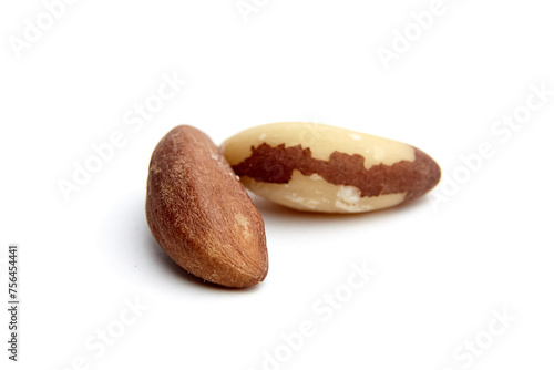 A focused image of two Brazil nuts, one face up and the other face down, against a white background photo