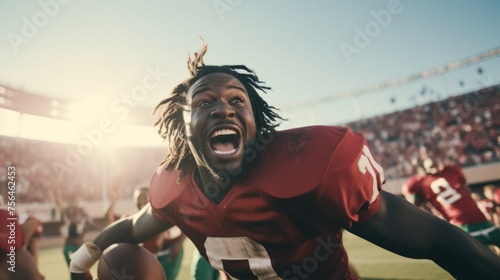 American football player celebrating victory and touchdown. Emotional celebration of winning the game.  photo