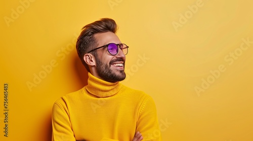 Smiling Man in Yellow Turtleneck Against Yellow Background