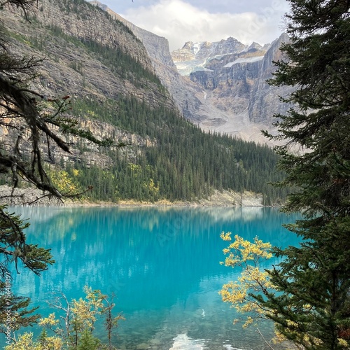 Photos Blue lake surrounded by tries and mountains