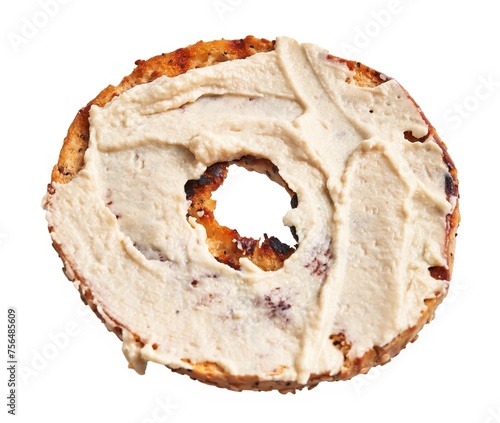 A single toasted bagel covered with cream cheese, isolated on a white background, showcasing a popular breakfast choice. photo