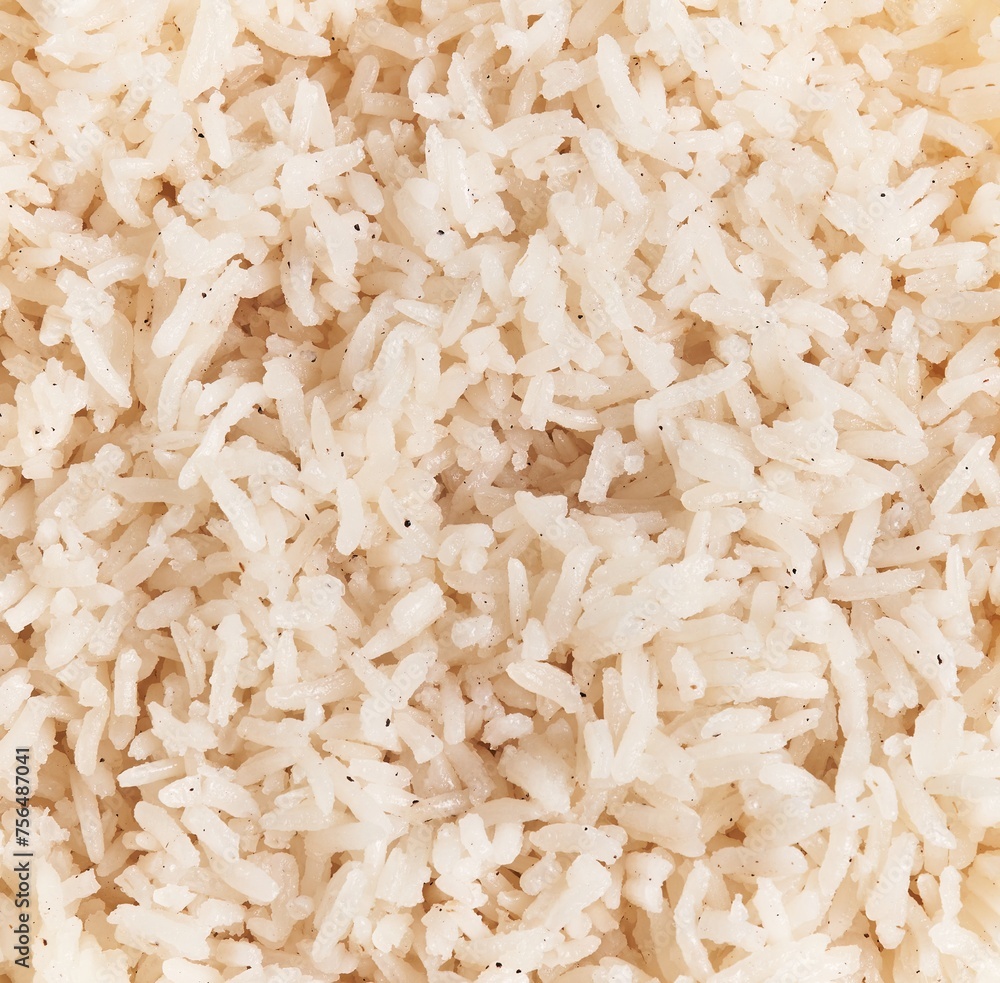 Close-up texture of cooked white rice, suitable for culinary backgrounds and food concepts. Close-up texture of cooked white rice, suitable for culinary backgrounds and food concepts.