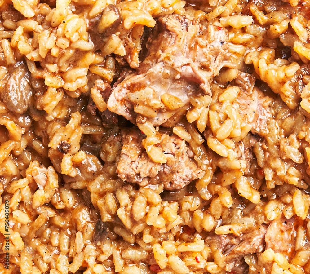 Close-up view of a traditional beef risotto dish, highlighting the rice texture and meat chunks Close-up view of a traditional beef risotto dish, highlighting the rice texture and meat chunks
