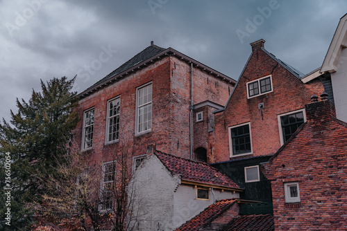 Amersfoort Netherlands, March 26 2023: Fairy tale urban landscape of the historic city of Amersfoort in rainy weather in the spring season photo