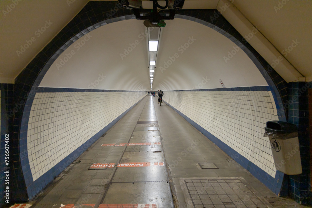Obraz premium Antwerp, Belgium. 15 April 2023. Sint Annatunnel is a pedestrian and bicycle tunnel under the river Schelde with wooden escalators, this is a 572 meter long tunnel.
