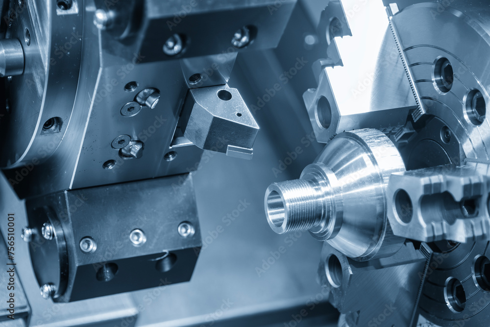 The CNC lathe machine forming cutting the metal shaft parts. The CNC lathe machine forming cutting the metal shaft parts.