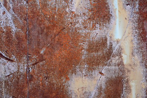 Abstract background. Rusty metal surface with scratches and remnants of white paint. An old weld. interesting unusual texture and pattern
