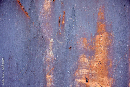 Abstract background of worn paint on a metal door. interesting unusual texture and pattern