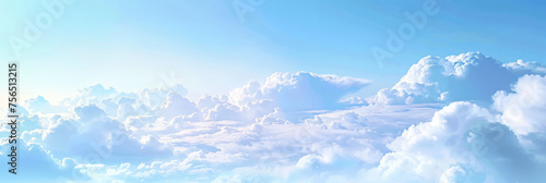 Beautiful sky with white clouds on a clear blue background. Soft clouds drift in the sky. A sky landscape with fluffy white clouds. Clouds banner.
