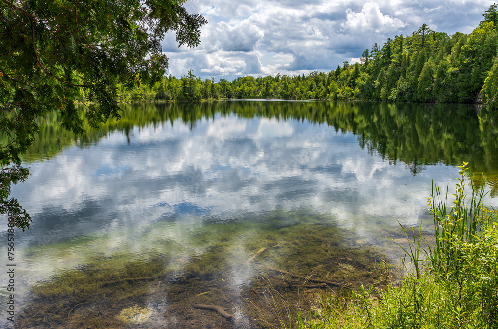 Fototapeta premium Crawford Lake, one of the few meromictic lakes (deep waters don't mix with surface waters) around the world, highlight of the Crawford Lake Conservation Area, south of Milton, Ontario Canada