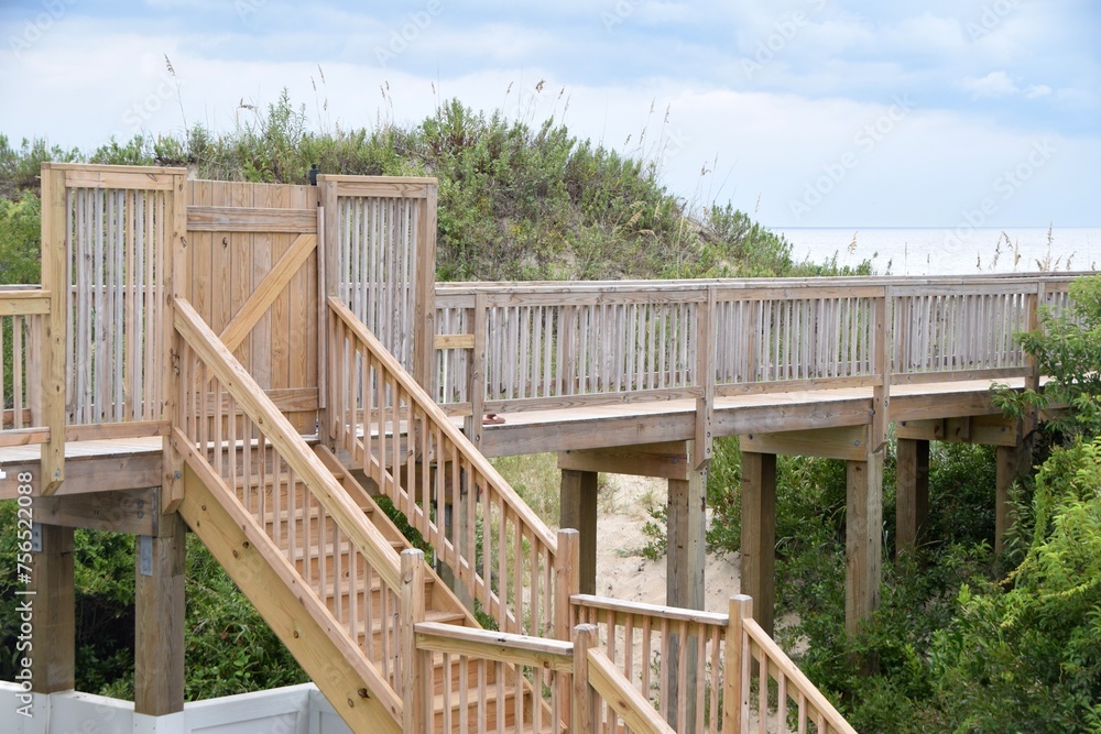 Fototapeta premium wooden bridge stairs built for beach access