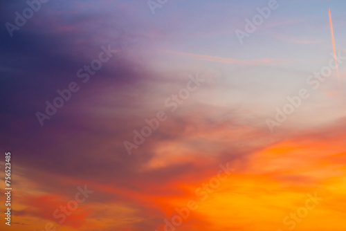  Beautiful sunset sky with amazing colorful clouds against deep blue © EwaStudio