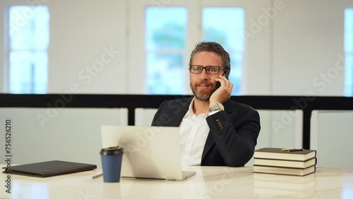 Wallpaper Mural Businessman talking on phone at office. Employee talking on phone. Phone meeting. Business man using phone. Ceo manager chatting on smartphone. Business talk. Man solving problems on smartphone. Torontodigital.ca