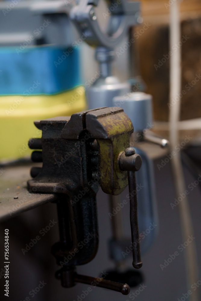 Green metal bench vise close-up Green metal bench vise close-up