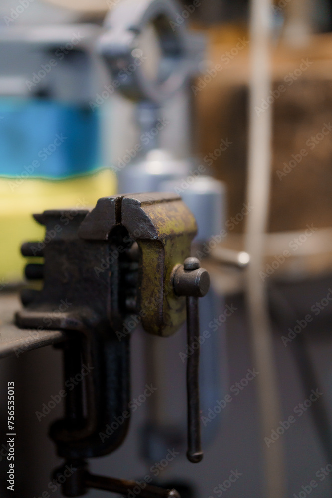 Green metal bench vise close-up Green metal bench vise close-up
