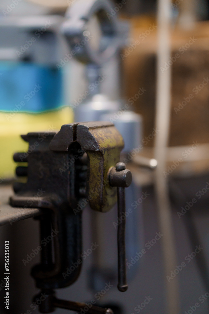 Green metal bench vise close-up