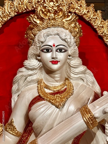 Devi Saraswati: The Hindu goddess of knowledge wearing white saree photo