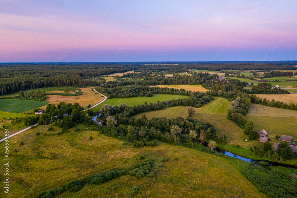 Summer rural landscape in the evening with beautiful sky, aerial view.