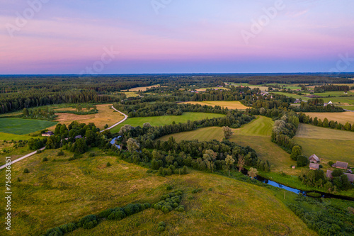 Summer rural landscape in the evening with beautiful sky, aerial view.