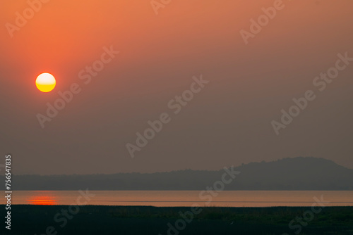 Landscape of sunset at Tadoba Andhari National park near Irai dam photo