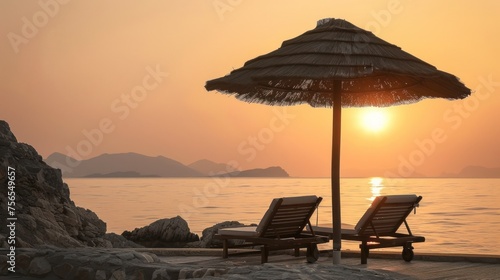 view of two chairs with umbrellas on the beach © zaen_studio
