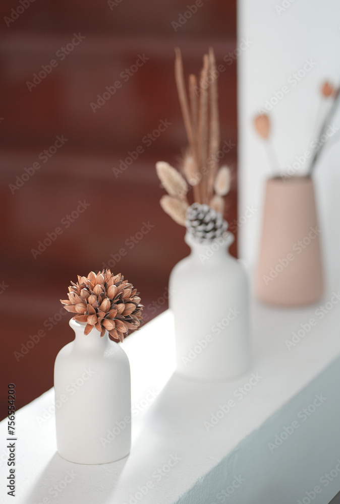 Close up and selective vase of flower on white cement table in living room, copy space concept. Close up and selective vase of flower on white cement table in living room, copy space concept.