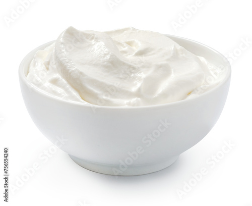 Sour cream or yogurt in white bowl isolated