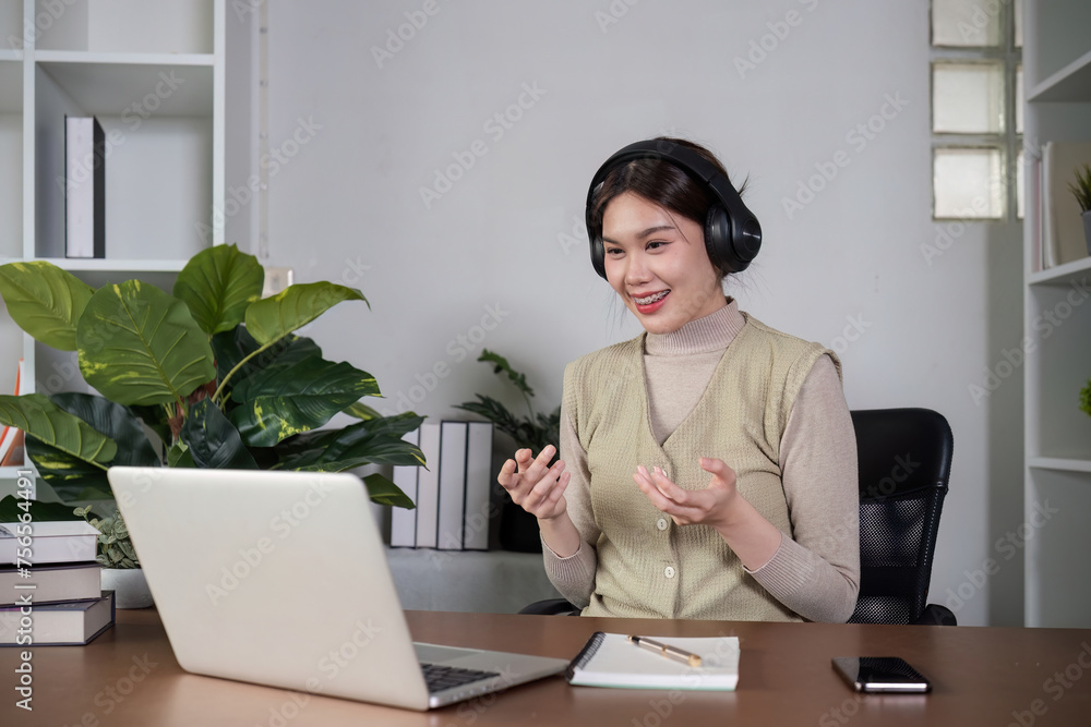 Asian female student studying online Video calls through Zoom about business administration and accounting subjects attentively Asian female student studying online Video calls through Zoom about business administration and accounting subjects attentively