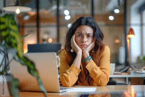 Hispanic businesswoman disappointed and sad talking on video call in online meeting with colleagues partners, woman sitting at workplace inside office. Generative AI