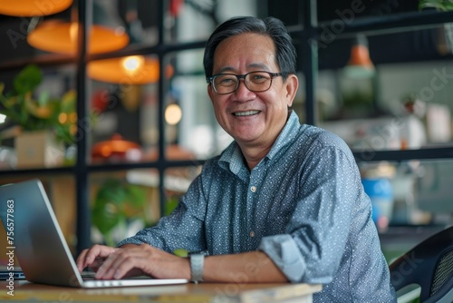 Successful mature asian working inside office using laptop, man typing on keyboard and smiling, businessman in shirt and glasses satisfied with work and achievement results, Generative AI