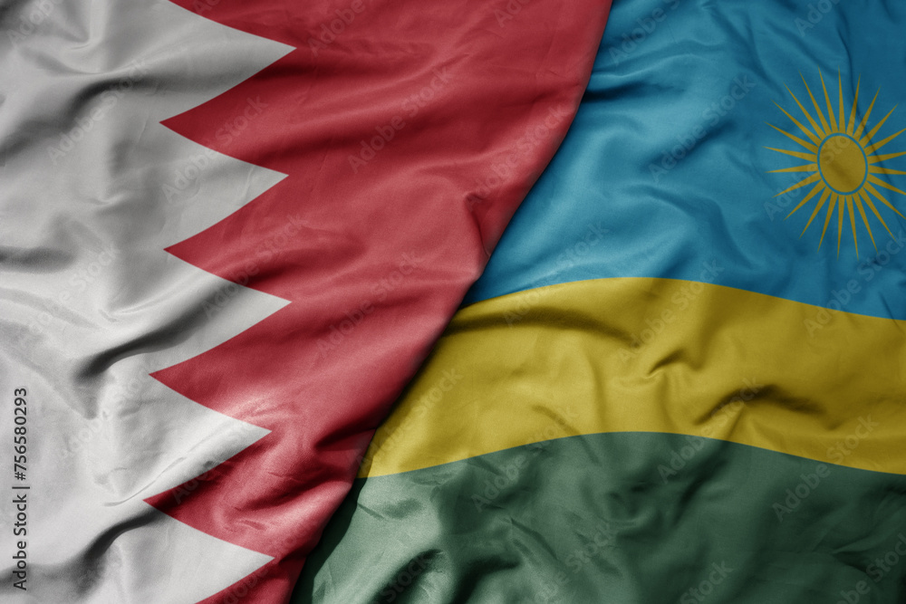 big waving national colorful flag of rwanda and national flag of bahrain.
