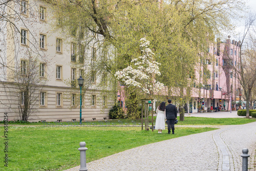 Asian wedding couple shooting in spring behind the state parliament of Saxony-Anhalt in Magdeburg photo