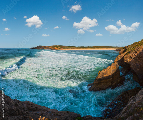 Summer evening Atlantic ocean coast landscape and Amoreira beach (Aljezur, Algarve, Portugal). Panorama.