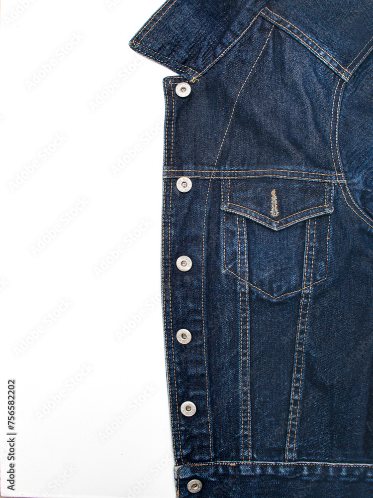 Dark blue denim jacket on a white background close-up
Dark blue denim jacket on a white background close-up