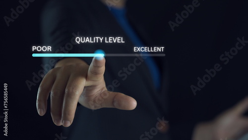 Businessman hand pointing to change quality level indicator scale from poor to excellent for customer satisfaction and evaluation concept. photo