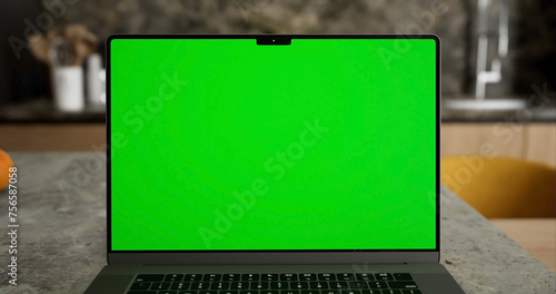Laptop place on room table, Green screen display, Close up monitor of notebook with mock up