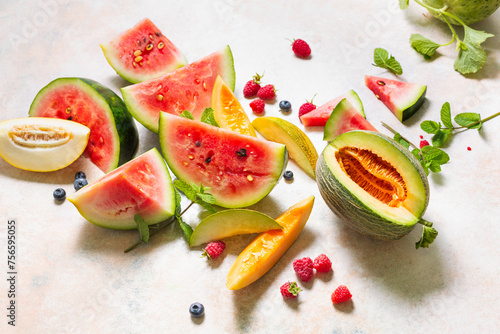 Various types of tasty ripe watermelon and melons with berry.