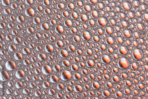 Abstract orange macro background with lots of soap bubbles.
