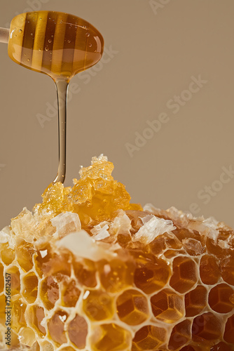 Honey Drizzling onto Fresh Honeycomb on Rustic Background