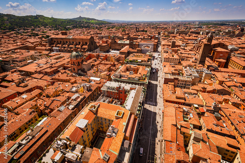 Bologna, skyline cityscape from Asinelli tower, Two Towers, Due Torri. Buildings, tiled roofs and streets of Bologna. Italian red city. Panoramic view of Bologna city. photo