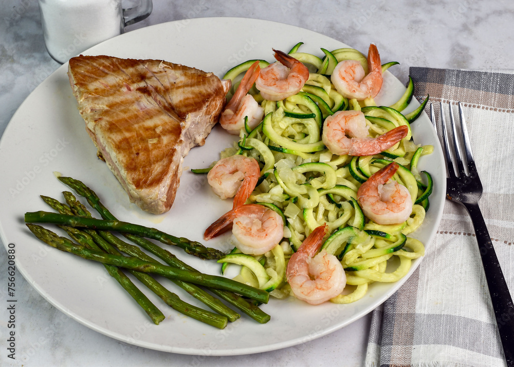 tuna steak served with zucchini noodle top with shrimp, tuna steak served with zucchini noodle top with shrimp,