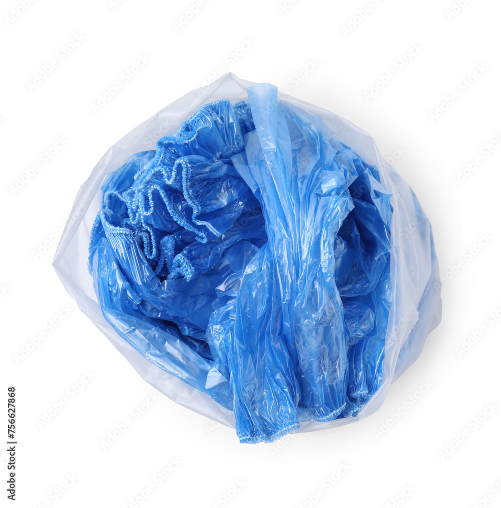 Blue medical shoe covers in package isolated on white, top view Blue medical shoe covers in package isolated on white, top view