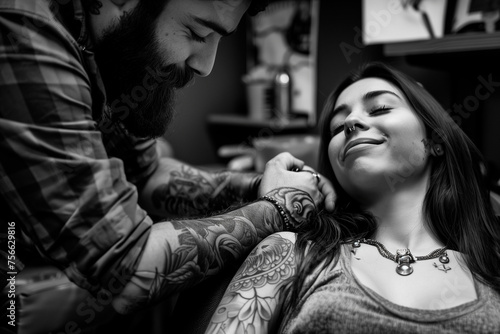 Tattooist working with a tattoo machine in a beauty salon