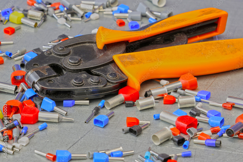 Electrical installation tools for installation of electrical panels. On a metal surface. Close-up.