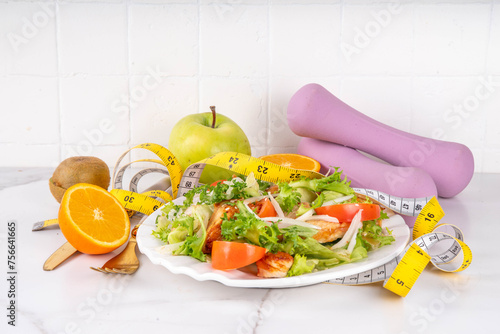 Balanced salad with fruit and fitness equipment