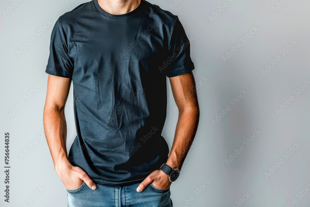 Casual Black T-Shirt on Young Man Against Grey Background Casual Black T-Shirt on Young Man Against Grey Background